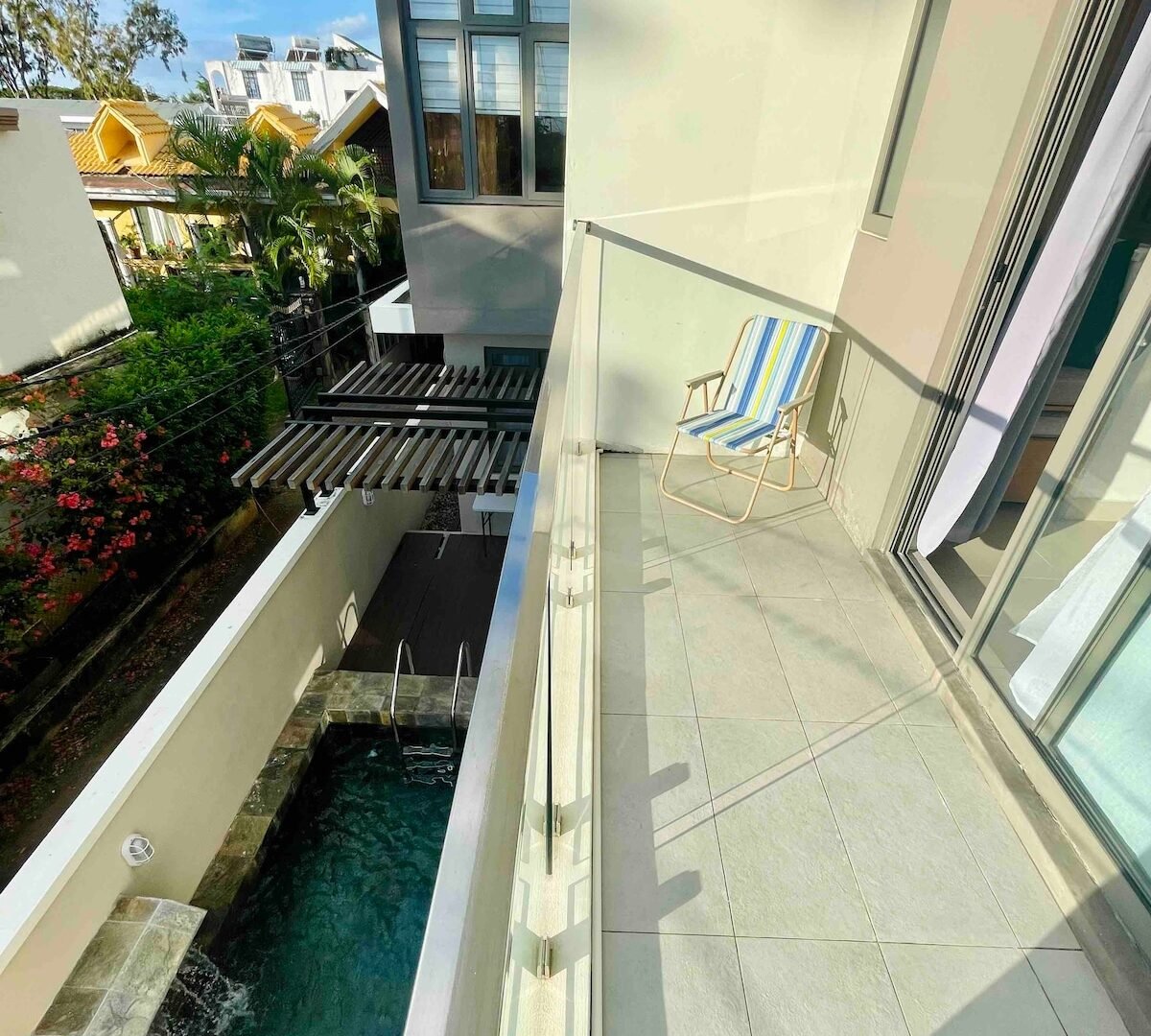 La Peregrina private balcony with pool view — Flic en Flac Mauritius